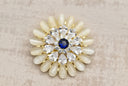 Elegant Crystal Bloom Brooch with Sapphire Center