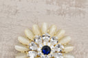 Elegant Crystal Bloom Brooch with Sapphire Center