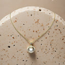 Lustrous Pearl Circle Pendant Necklace
